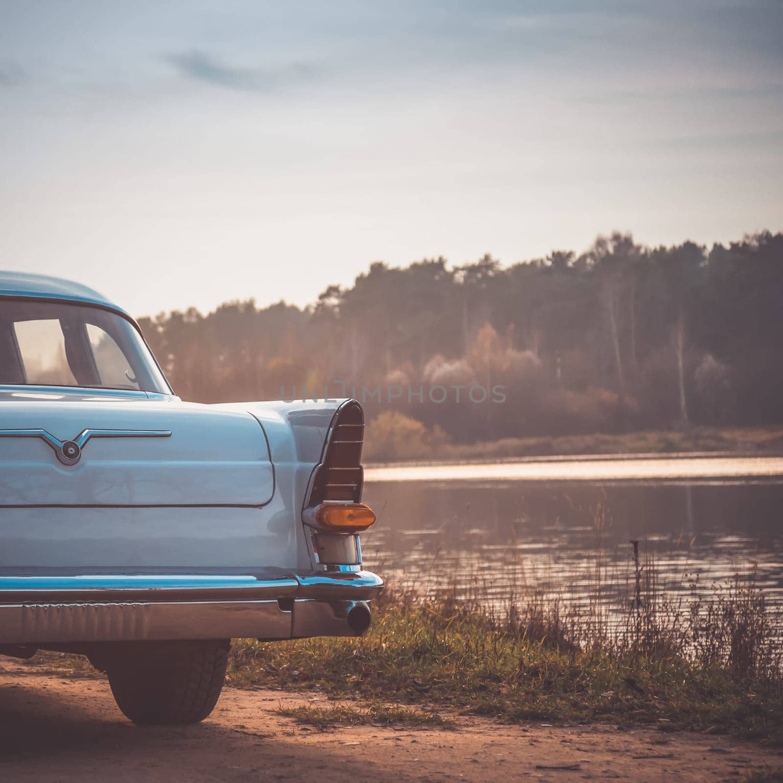 Old retro or vintage car or automobile back side with back light or taillight. Processed by vintage or retro effect filter