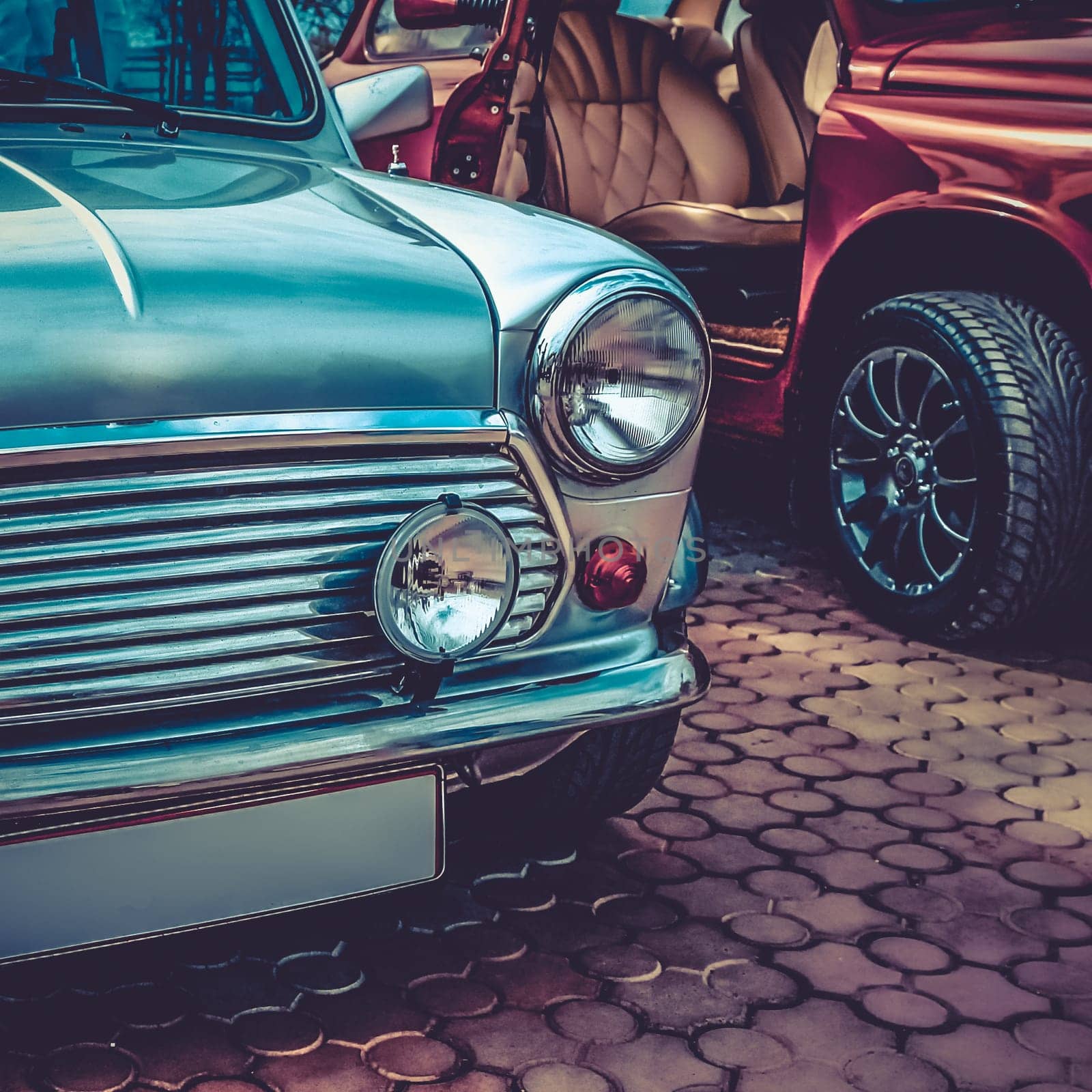 Old retro or vintage car or automobile front side with front lights or headlights and radiator grill. Processed by vintage or retro effect filter