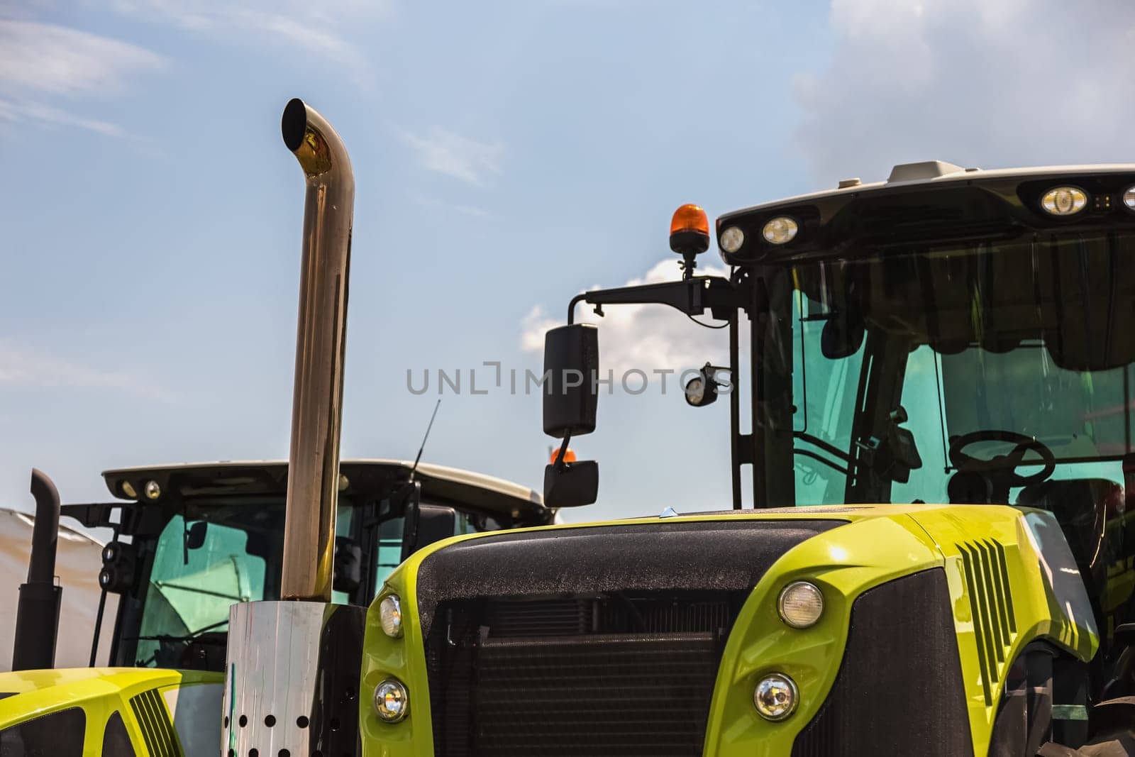 Cab of tractor closeup on sky background