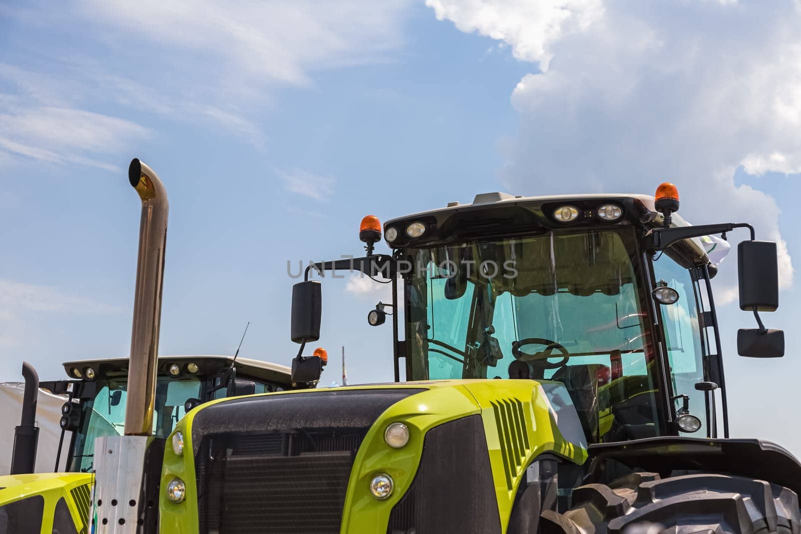 Cab of tractor closeup on sky background