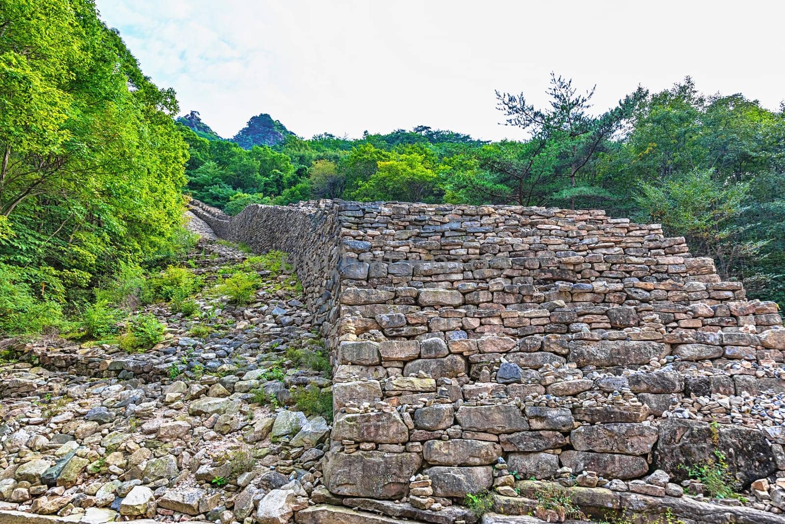 Big and long old stone wall old monument landmark in national park in South Korea