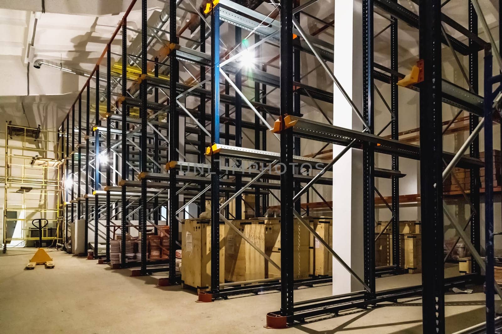 Warehouse interior with empty shelves on factory or plant