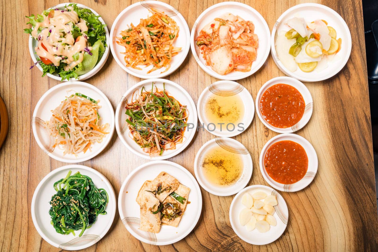 Spicy Kimchi group. Korean pickle or Pickled radish vegetables and seasoning on bowl on wood table background, Japanese food