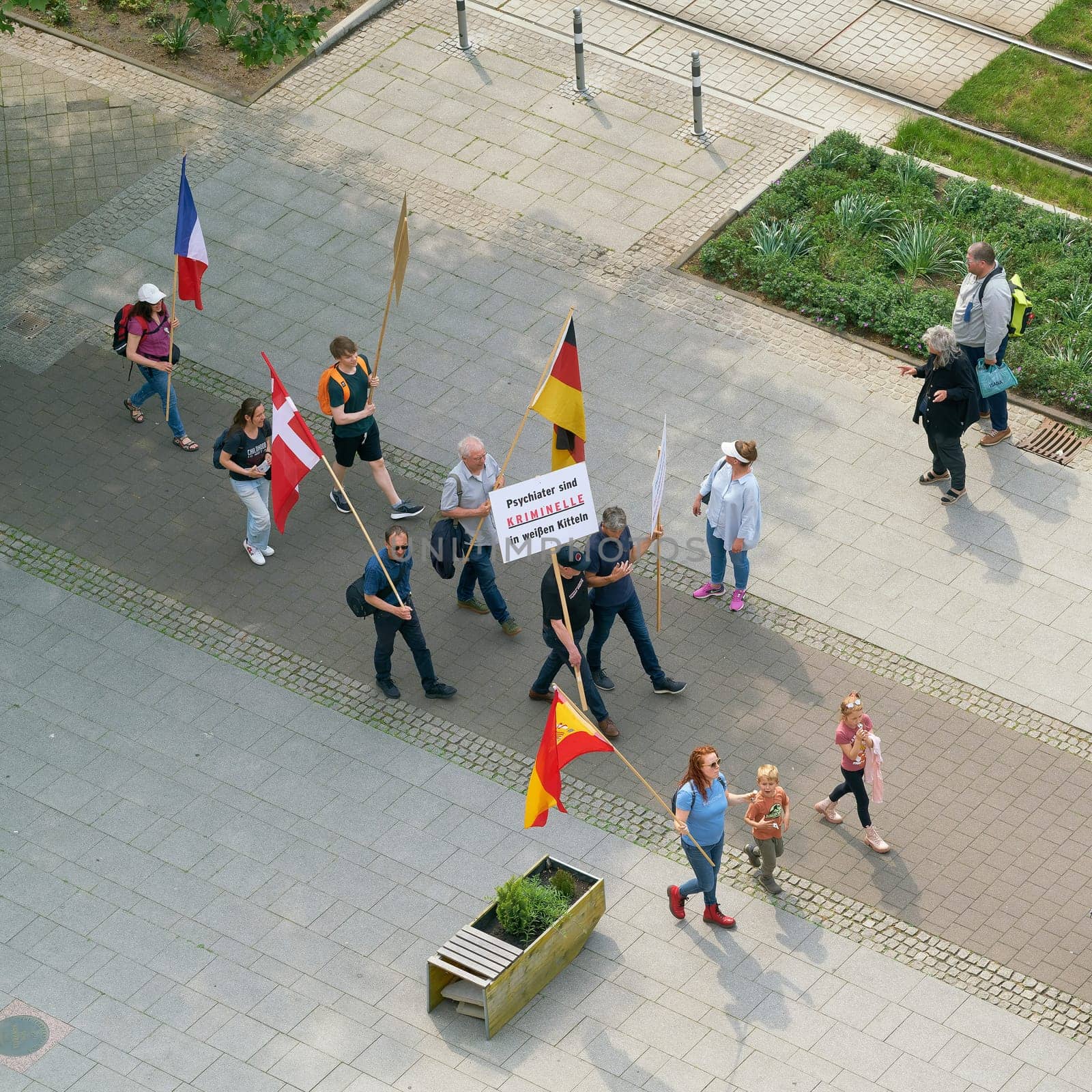 Protest against the Congress of German Child and Adolescent Psychiatry in Magdeburg. Translation on the sign: Psychiatrists are criminals in white coats