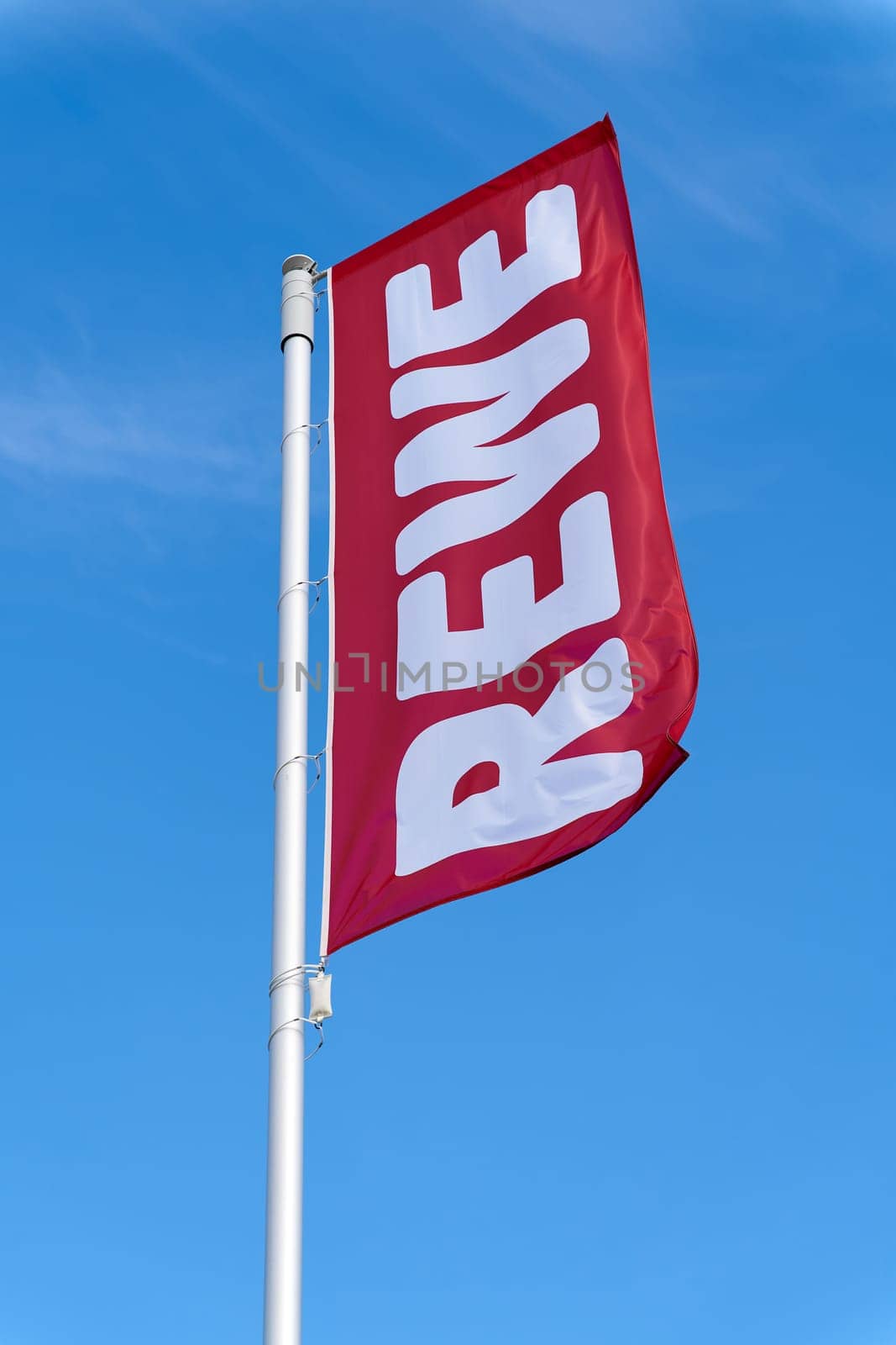 Flag in front of the new central warehouse of the German food retailer Rewe in Magdeburg