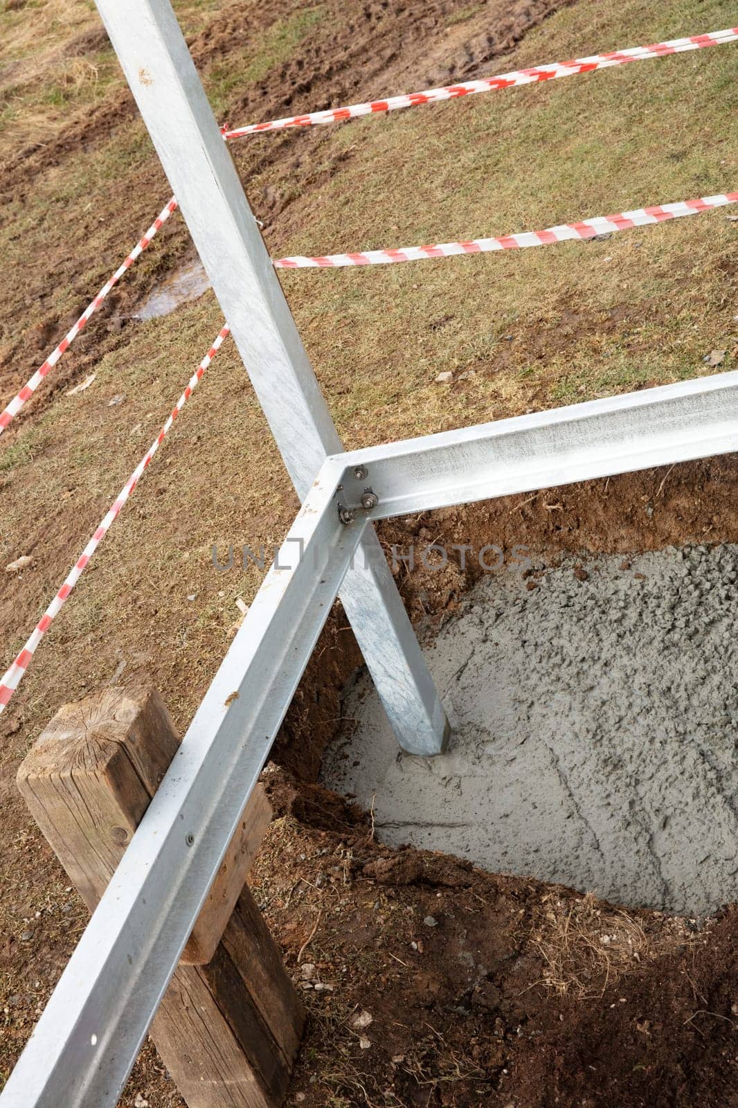 Foundation with cement in the metal construction of a balcony