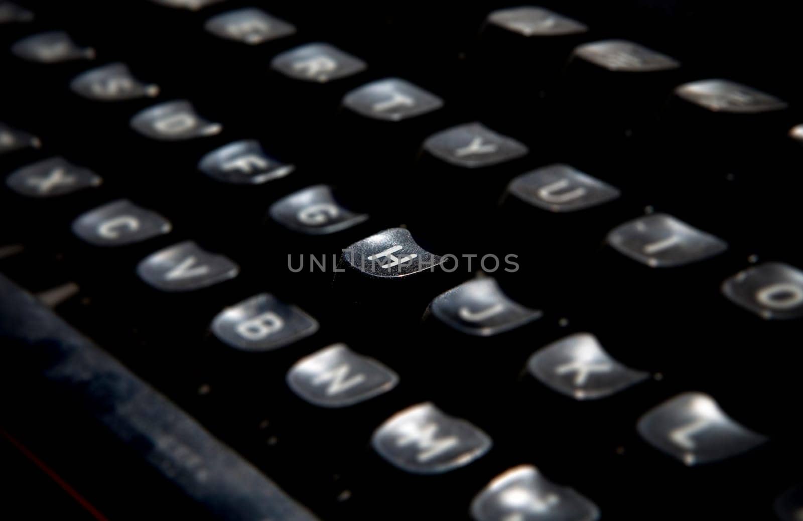 1970s dusty typewriter. Selective focus on key H