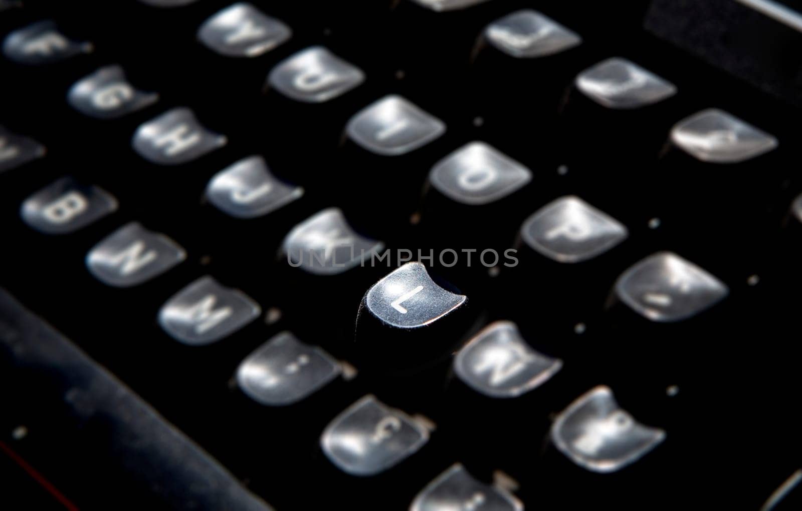 1970s dusty typewriter. Selective focus on key L