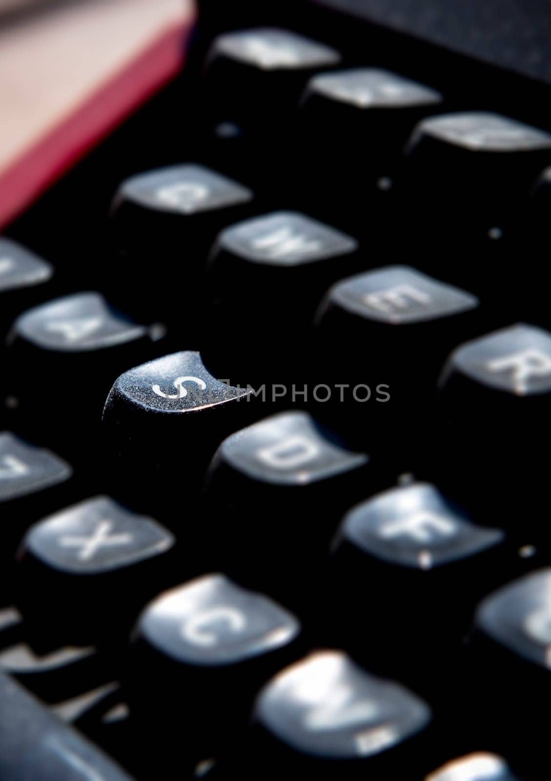 1970s dusty typewriter. Selective focus on key S