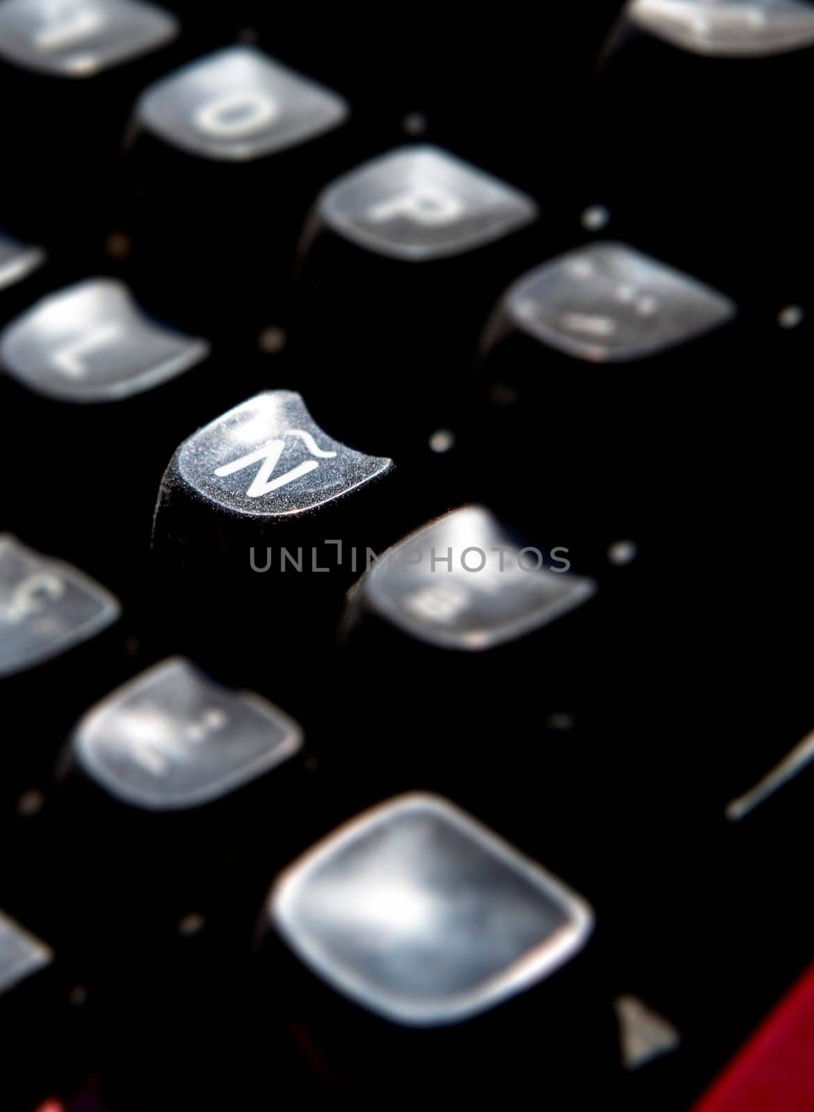 1970s dusty typewriter. Selective focus on key Ñ