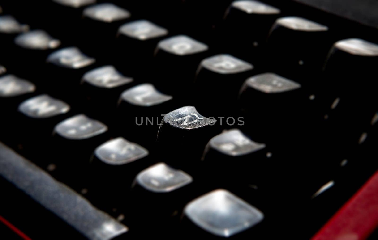 1970s dusty typewriter. Selective focus on key Ñ