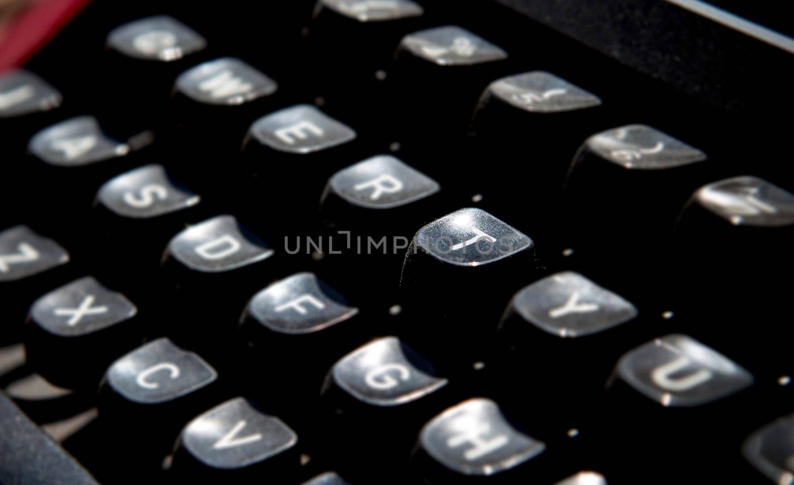 1970s dusty typewriter. Selective focus on key T