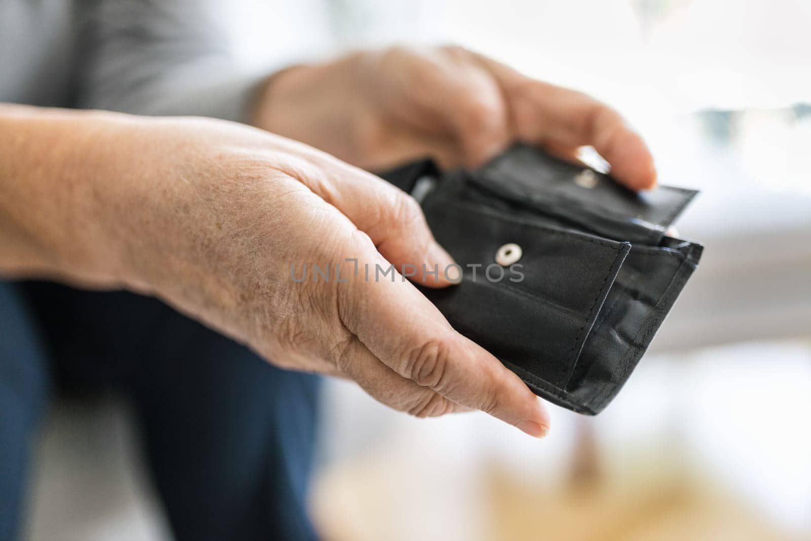 Desperate elderly woman unhappy with the rising cost of living