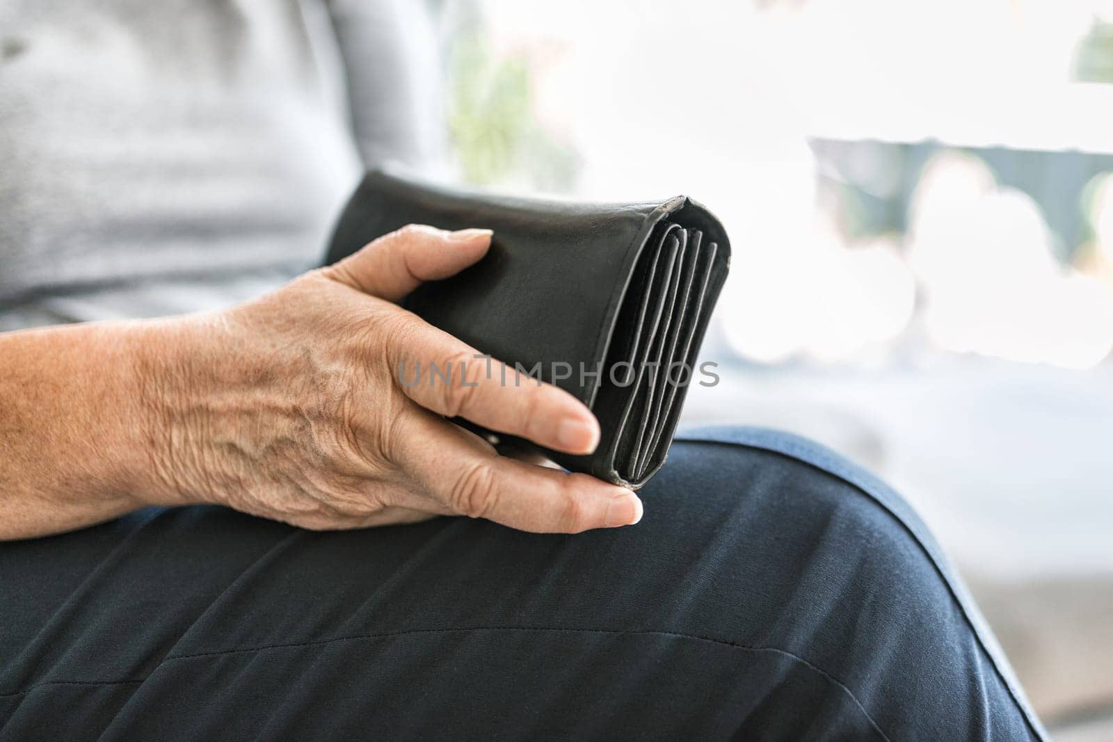 Desperate elderly woman unhappy with the rising cost of living