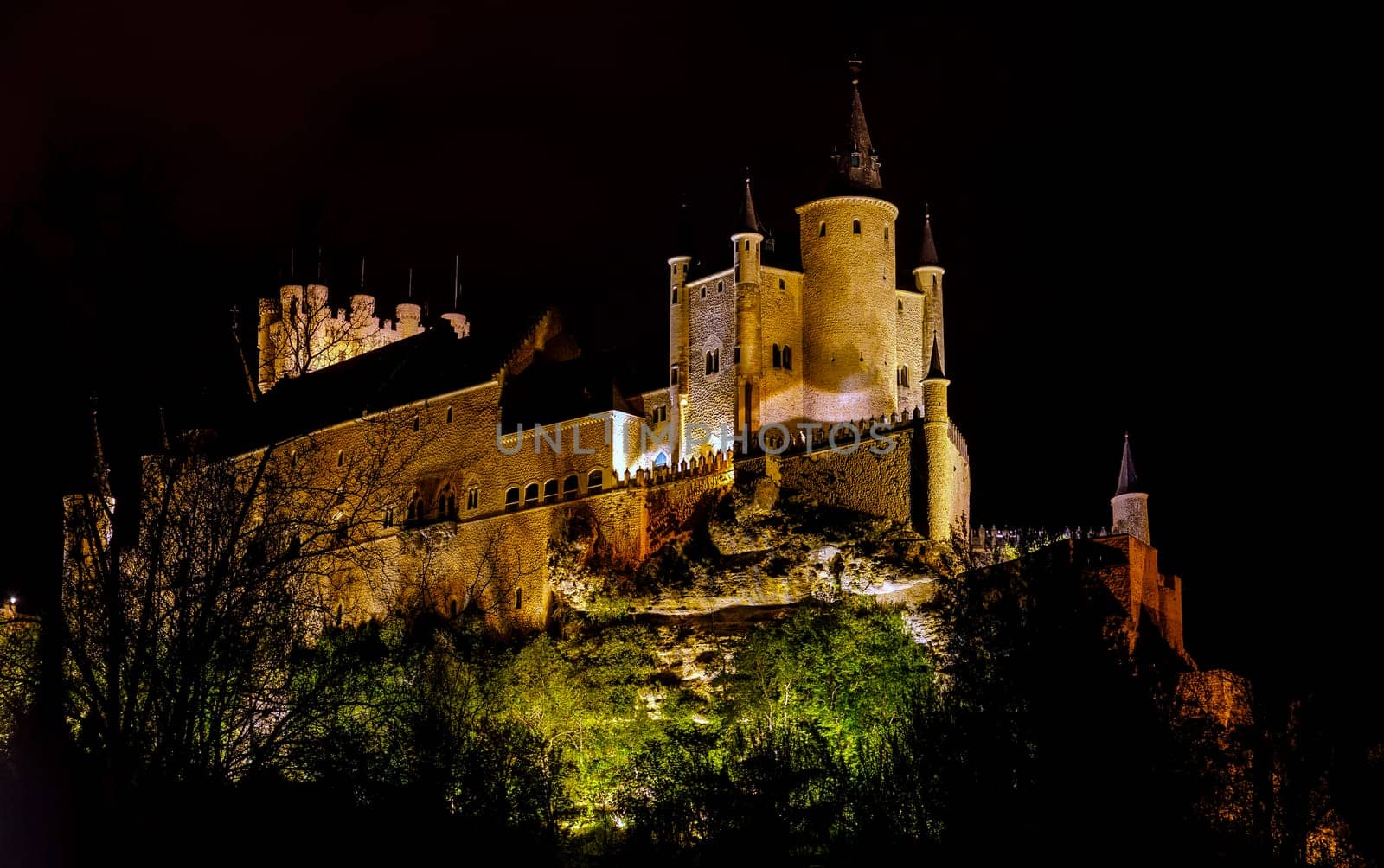 Alcazar of Segovia as the famous landmark at night in Spain