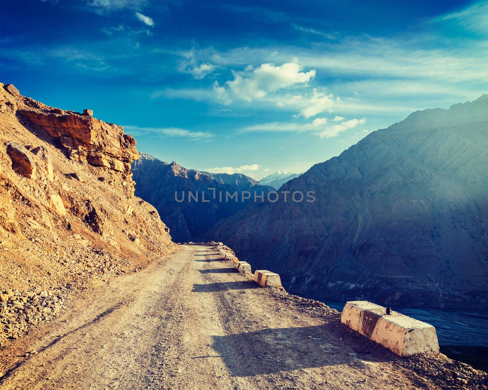 Vintage retro effect filtered hipster style image of road in Himalayas. Spiti Valley, Himachal Pradesh, India