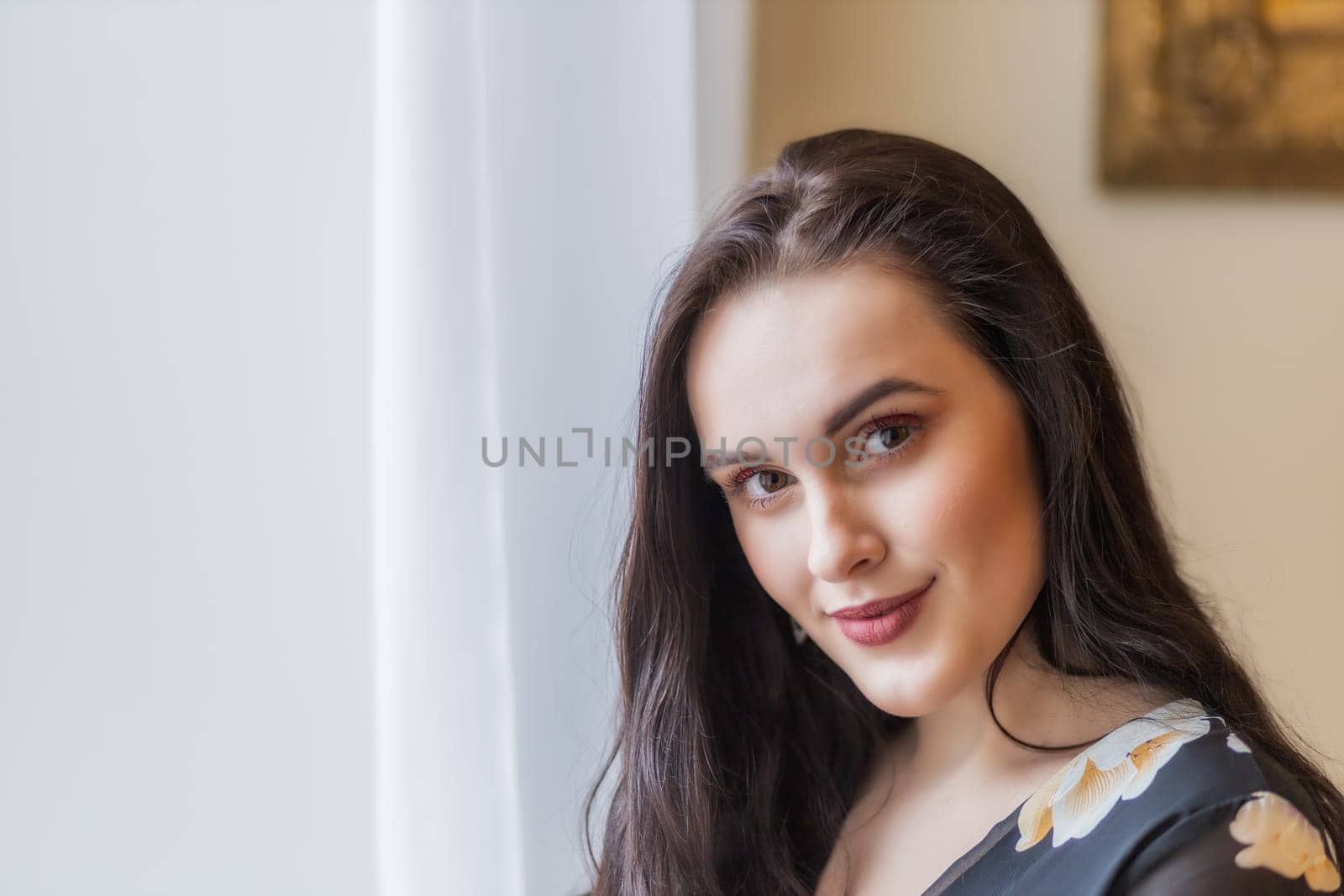 Portrait of attractive beautiful dark haired girl. Horizontally.