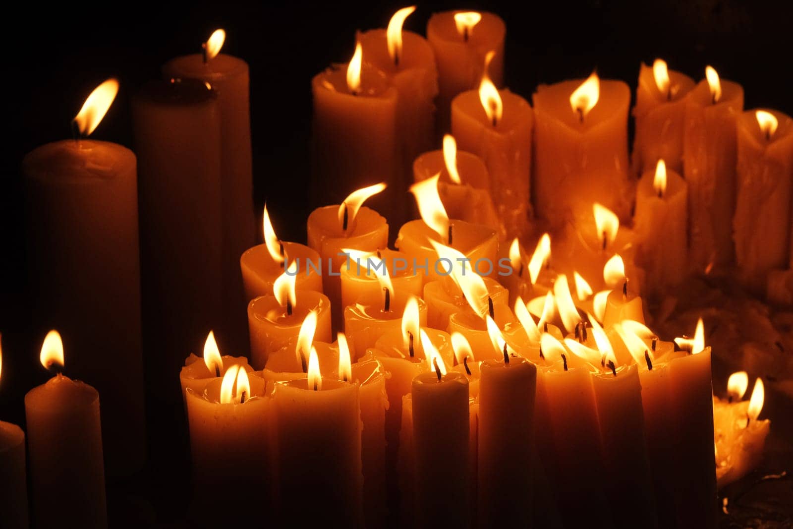 Lighting candles in chapel of Our Lady from the Kamenita vrata (Stone Gate) in Zagreb to remember and honor the deceased loved ones