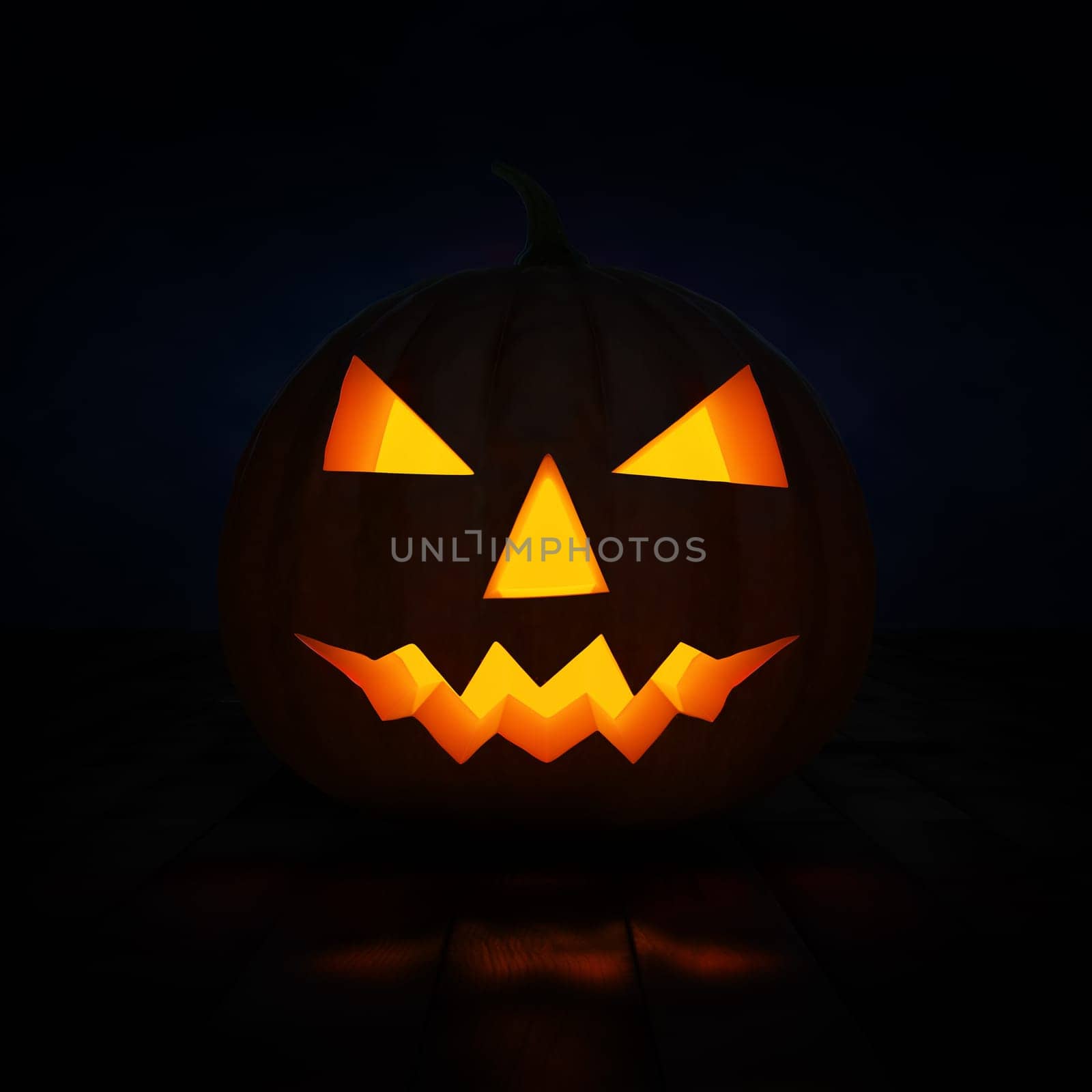 Halloween concept design background - scary Jack-o'-lantern carved pumpkin with candle light inside