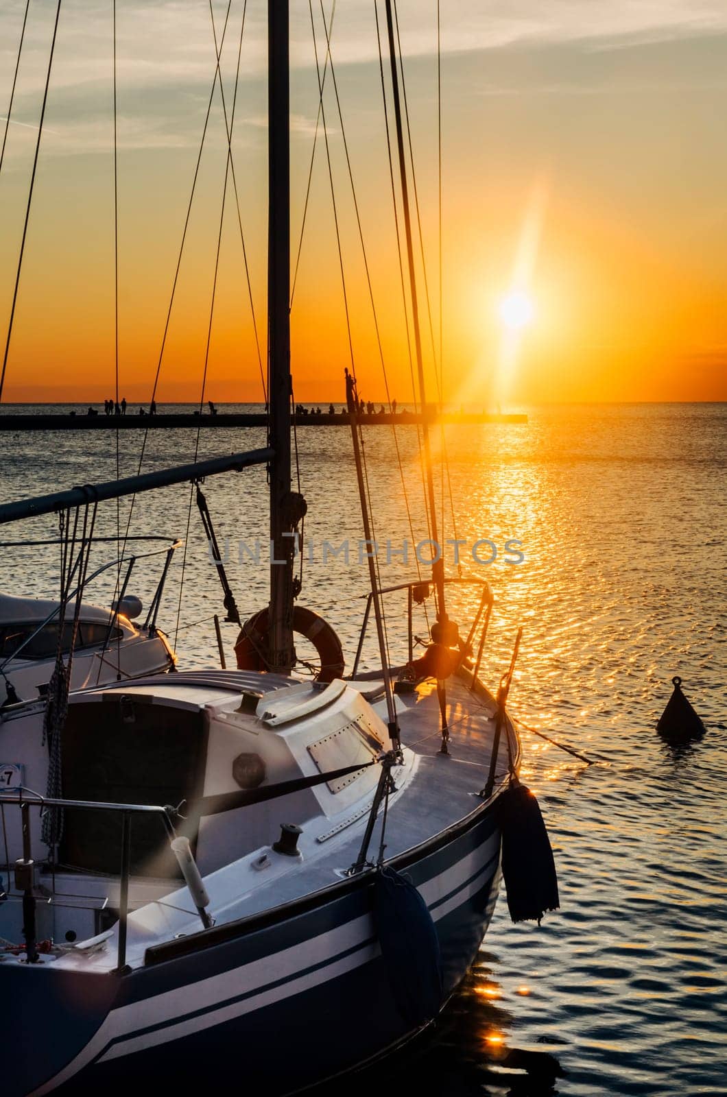 Luxary yacht in marina. Holiday traveling by sail boat at beautiful sunset in summer.