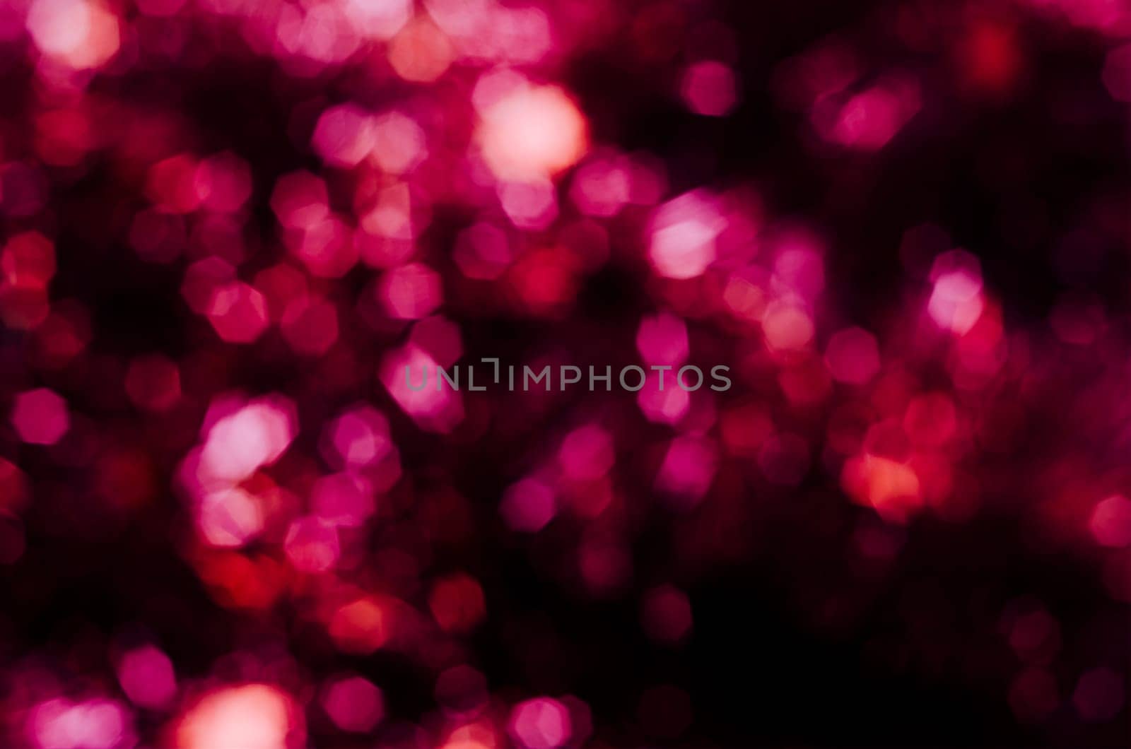 Abstract purple octagonal bokeh background with retro filter.Christmas lights blurred.