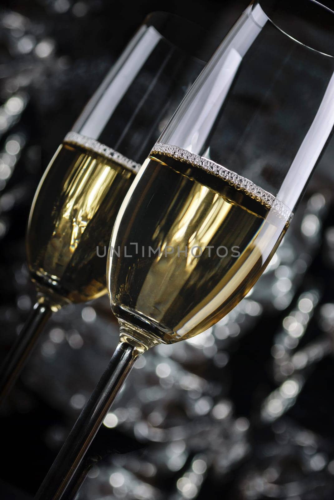 Two Champagne Glasses in front of the night lights
