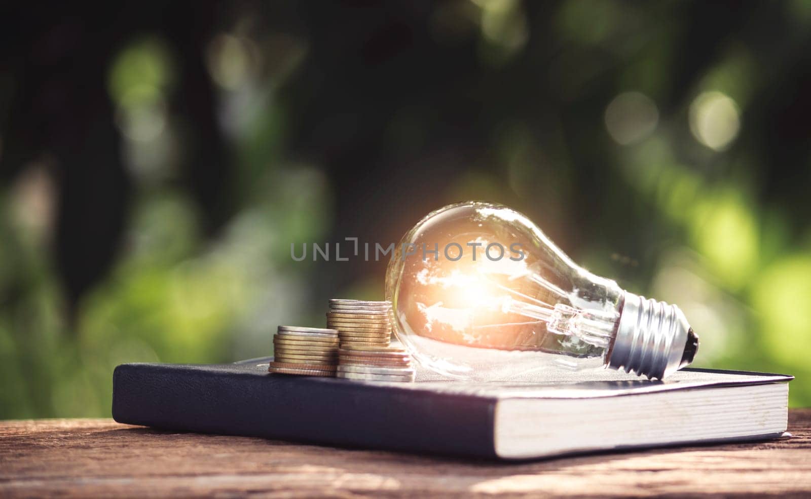 Light bulb and a book on table and copy space for insert text.