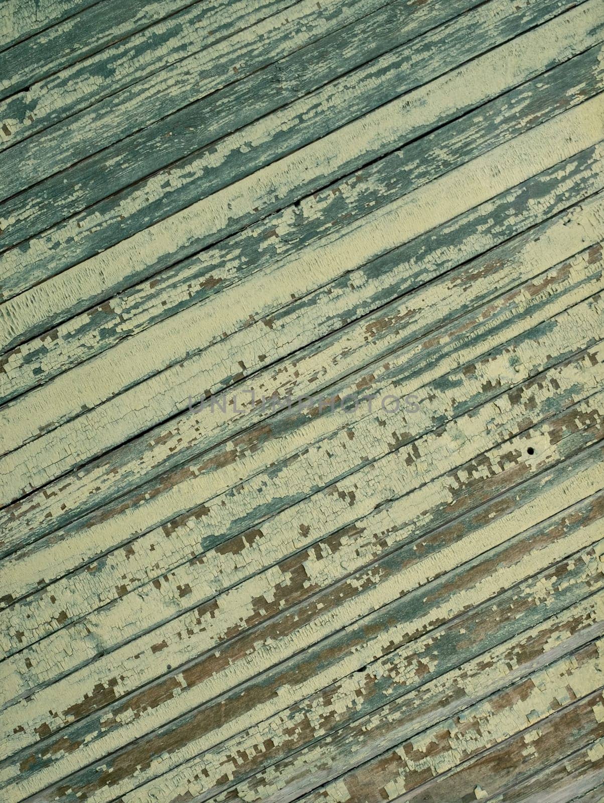 An old wooden diagonal plank wall brown and green aged