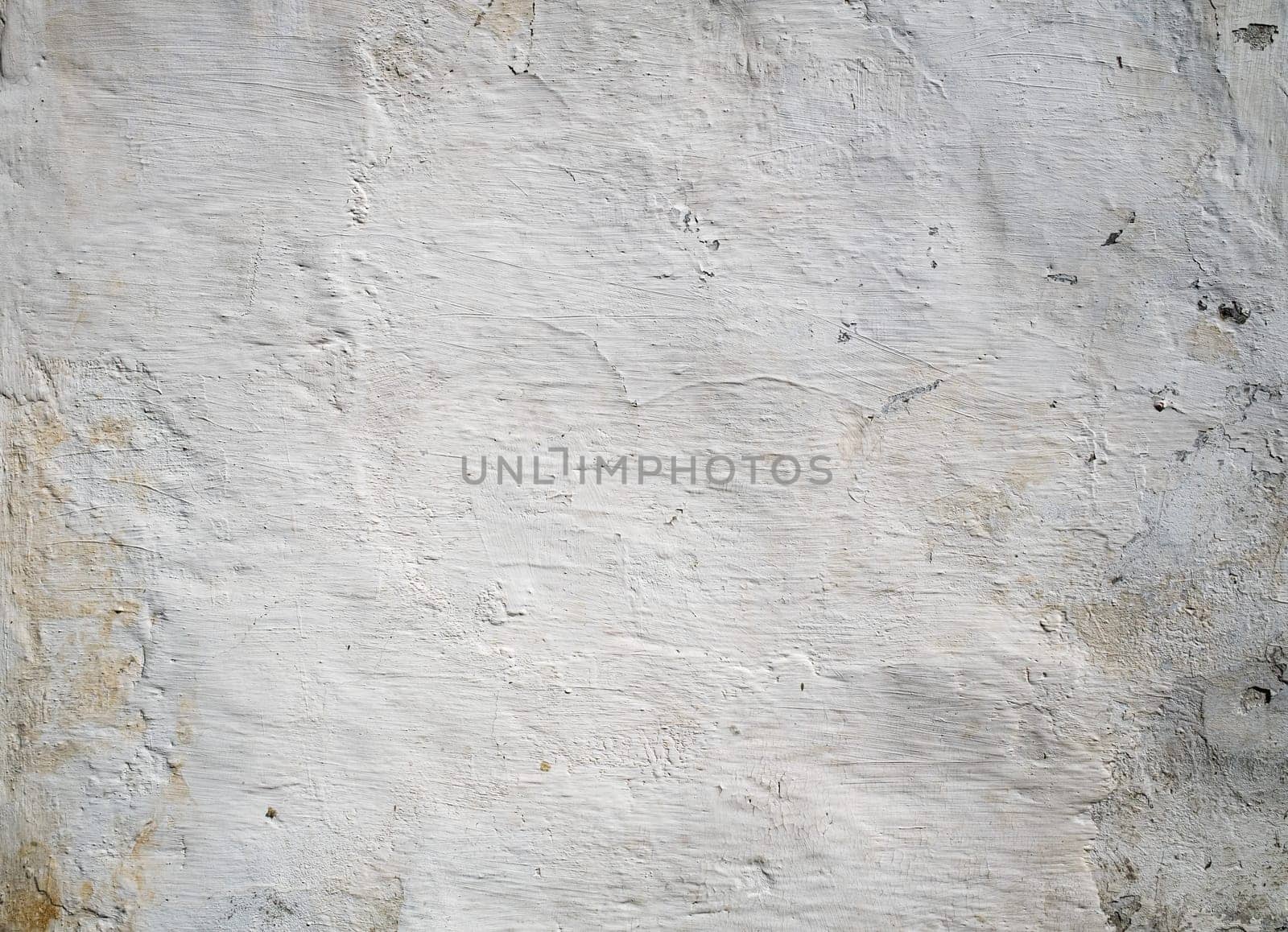 An old peeling whitewash wall background aged