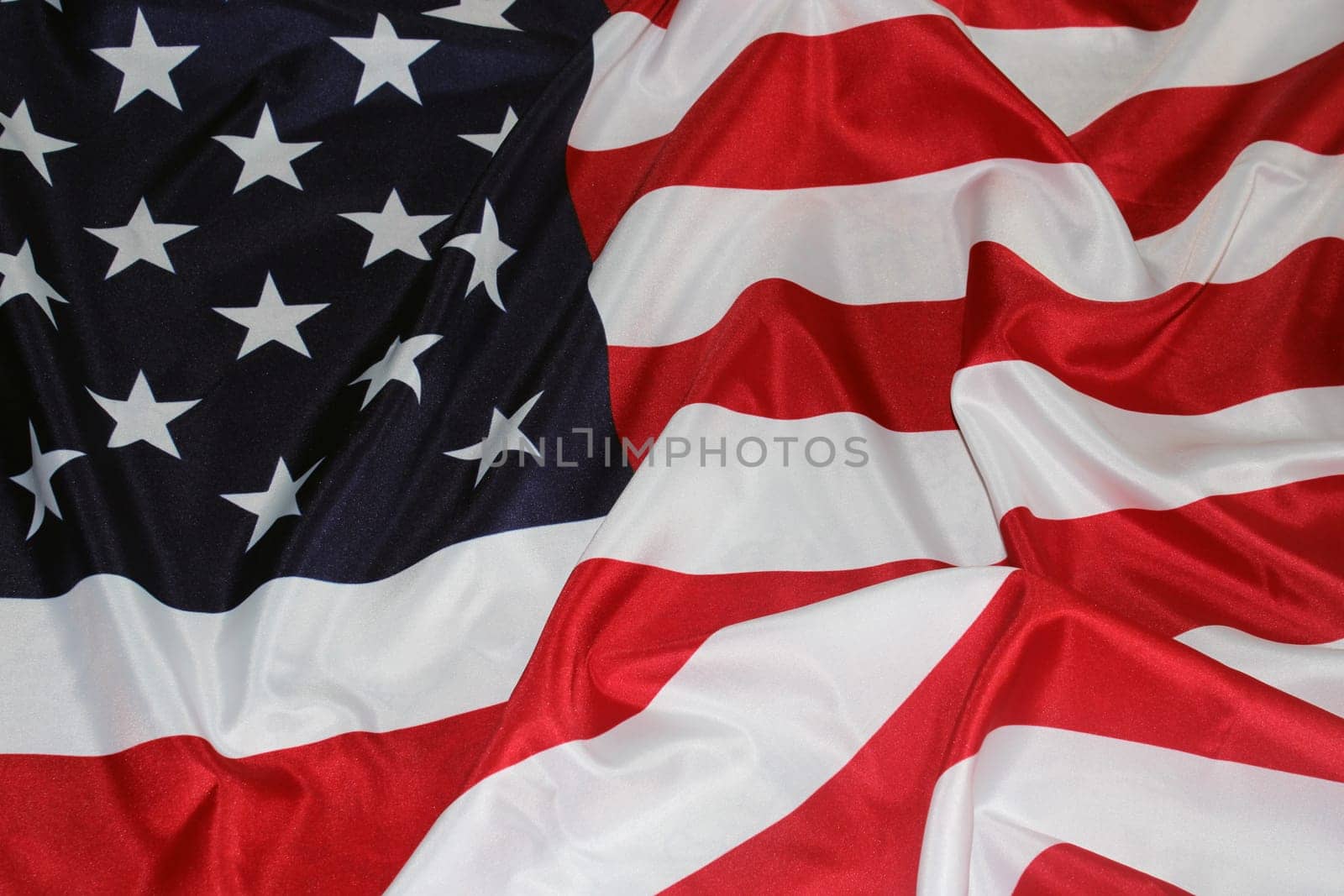 The flag of the United States, folded in waves. Flag Day. The concept of Independence Day, Memorial Day, elections..