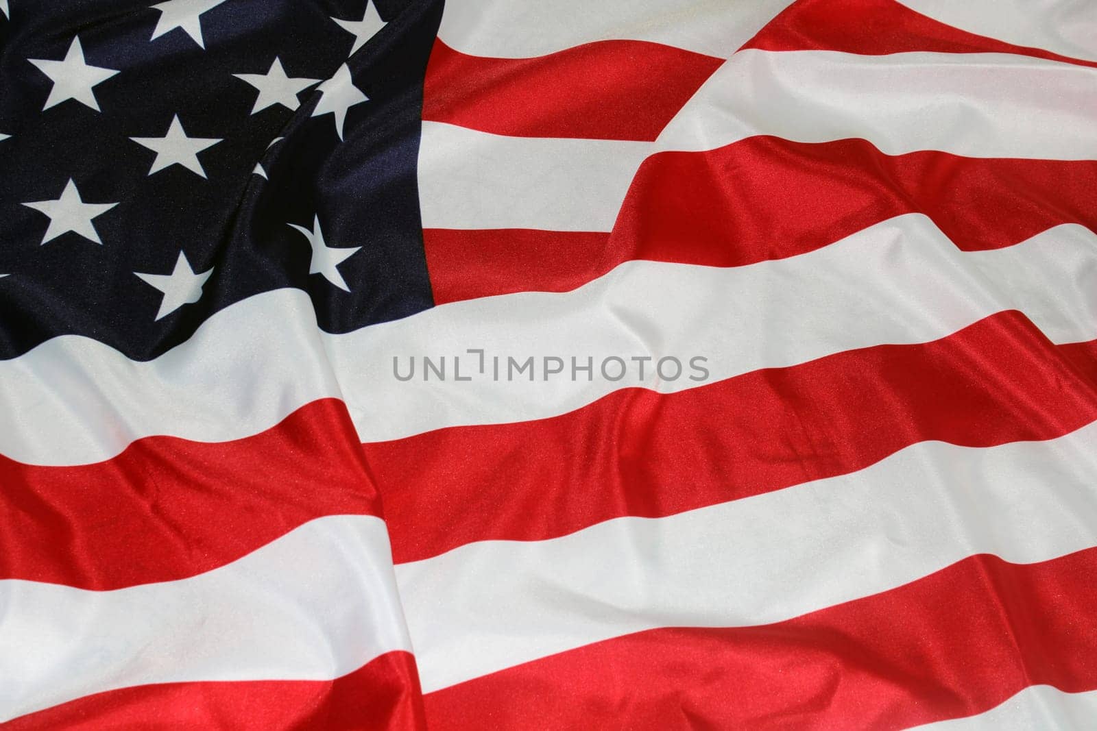 The flag of the United States, folded in waves. Flag Day. The concept of Independence Day, elections, Memorial Day..