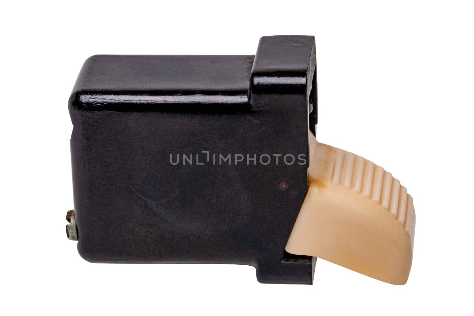 Old car parts. Close-up of an ivory-coloured fluted electric switch buttom with four connections for the car interior. Clipping path. GDR vehicle electrics around 1960 isolated.