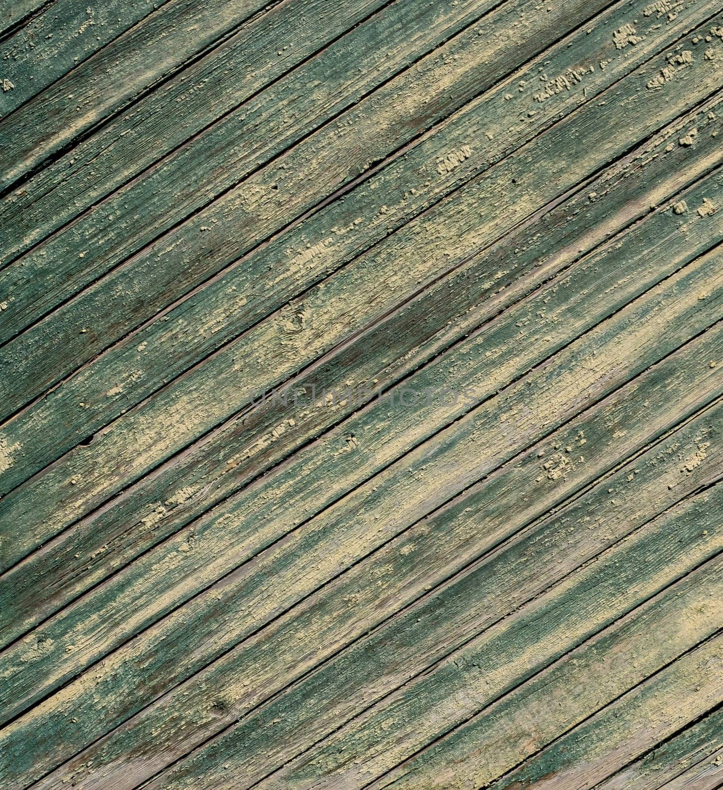 An old wooden diagonal plank wall brown and green aged