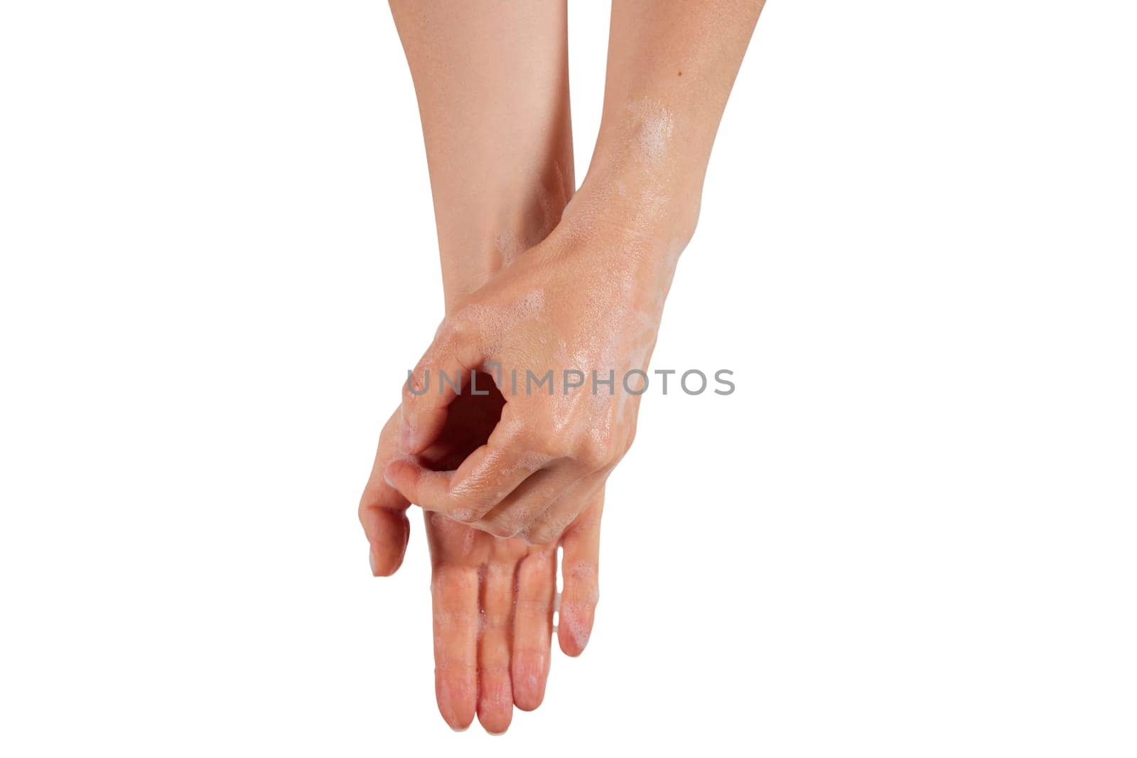 Anonymous woman removing soap from wet hands during hygienic routine against white background