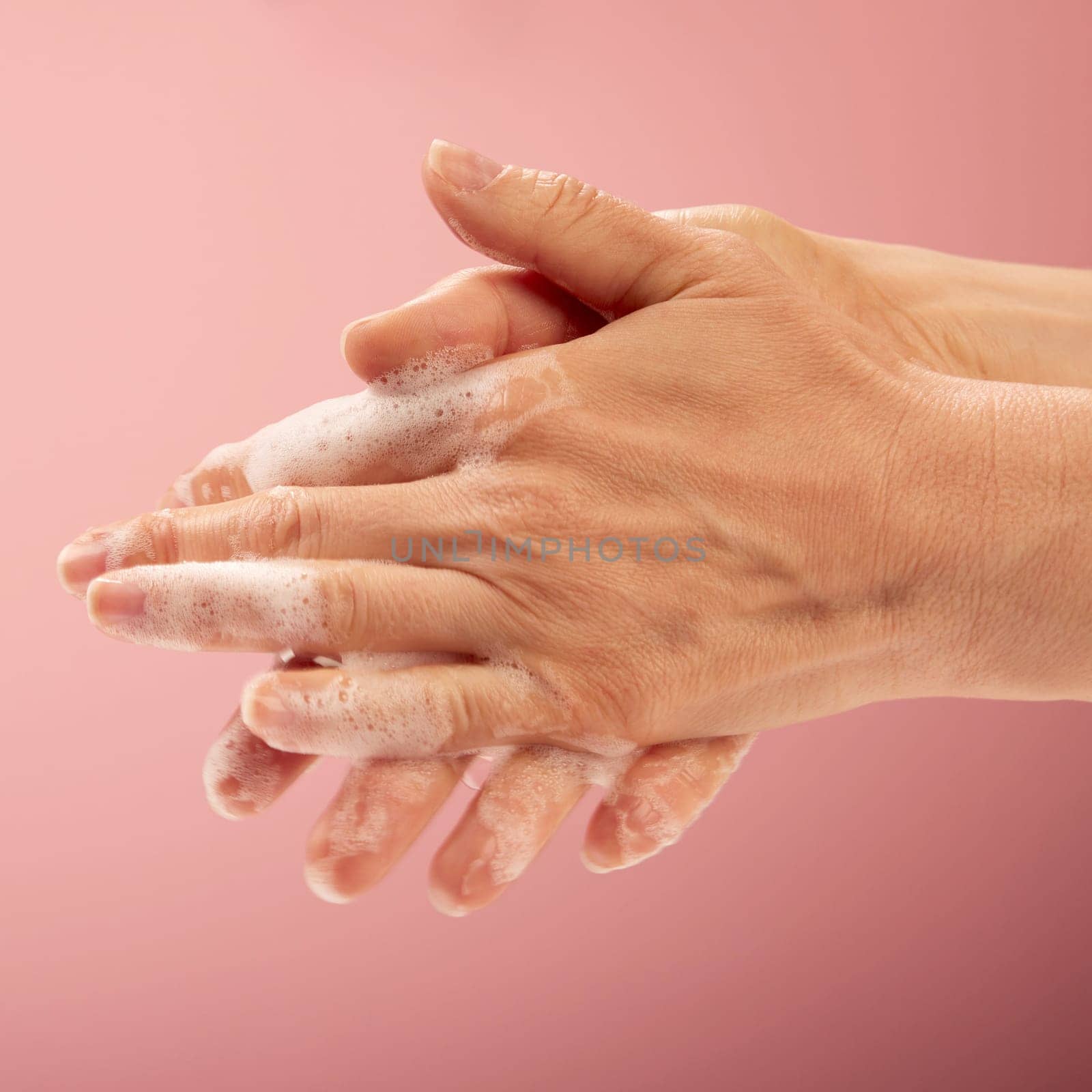 A part of washing perfect the hands. Concept of the hygienic rules of cleaning the hands with soap, foam and water.
