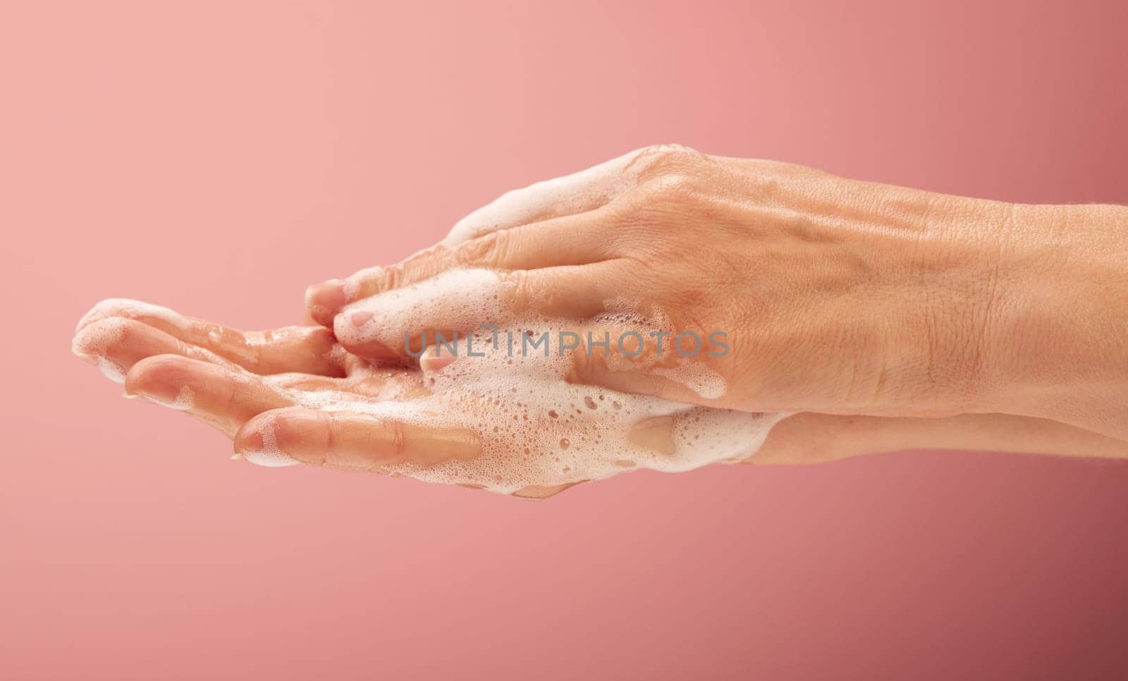 Young woman nurse cleaning her hands for medical disinfection body parts concepts.