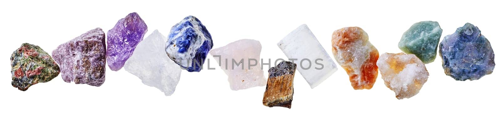 Collection of various colorful water stones for mineral water with different shapes isolated on clear white background in light studio