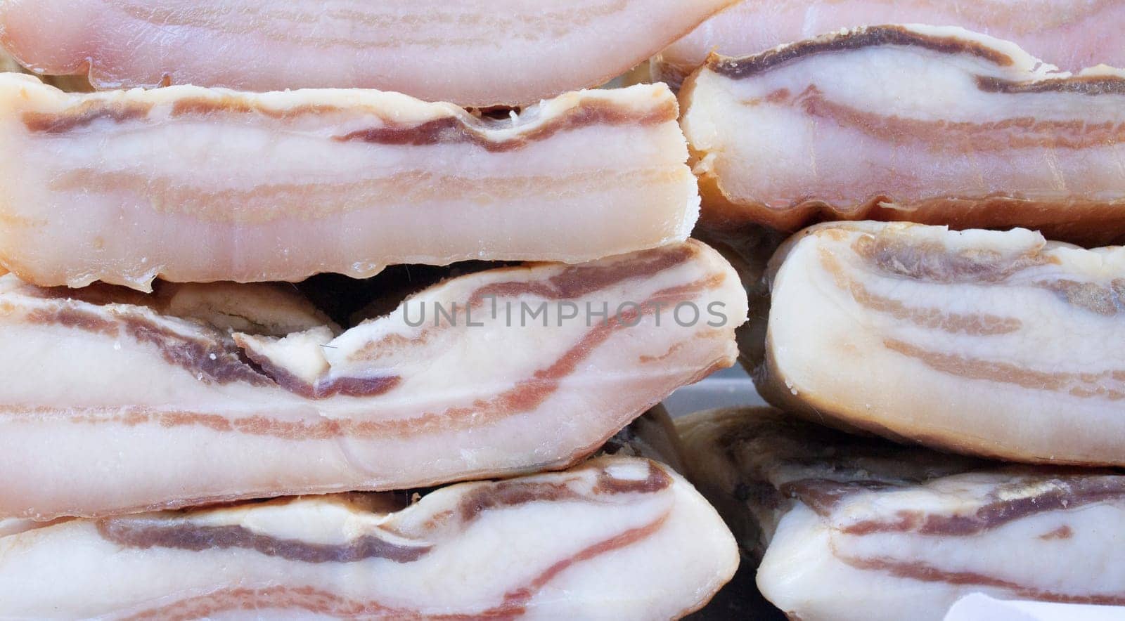 Iberian salt-cured pork fat. Pieces displayed at street market stall