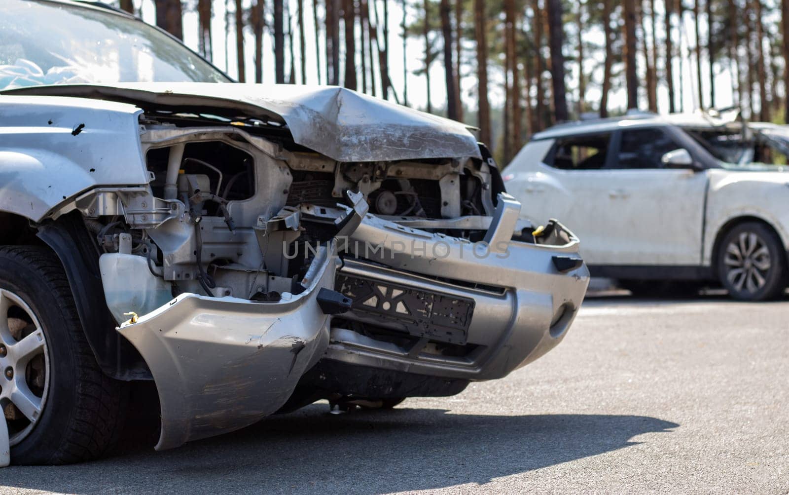 Traces of shots on the body of the car. War between Russia and Ukraine. Part of a civilian car that was fired upon during the evacuation of unarmed people from the combat zone