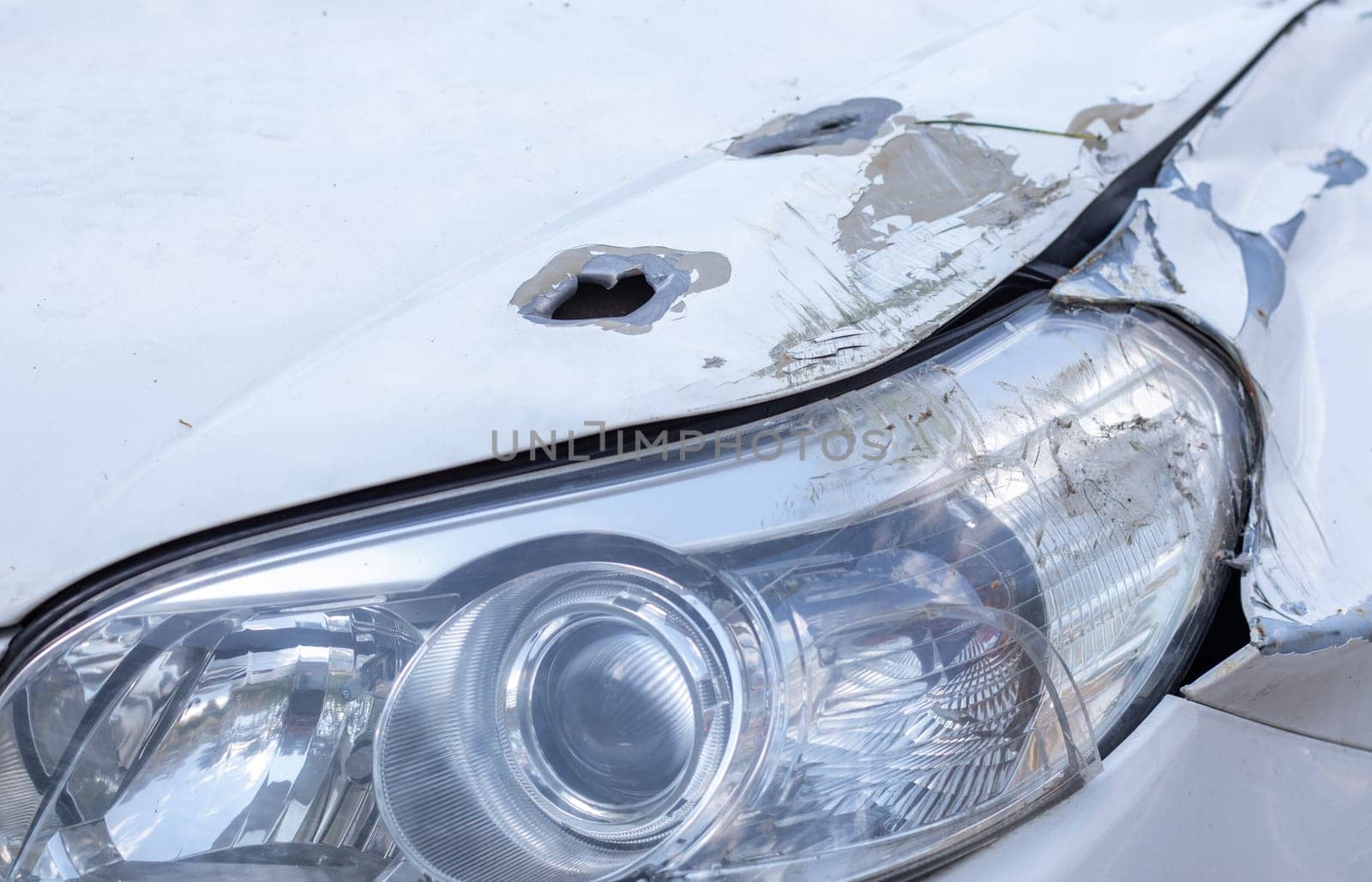 Car riddled with bullets. War of Russia against Ukraine. A car of civilians shot by the Russian military during the evacuation of women and children. Traces of bullets and fragments of shells