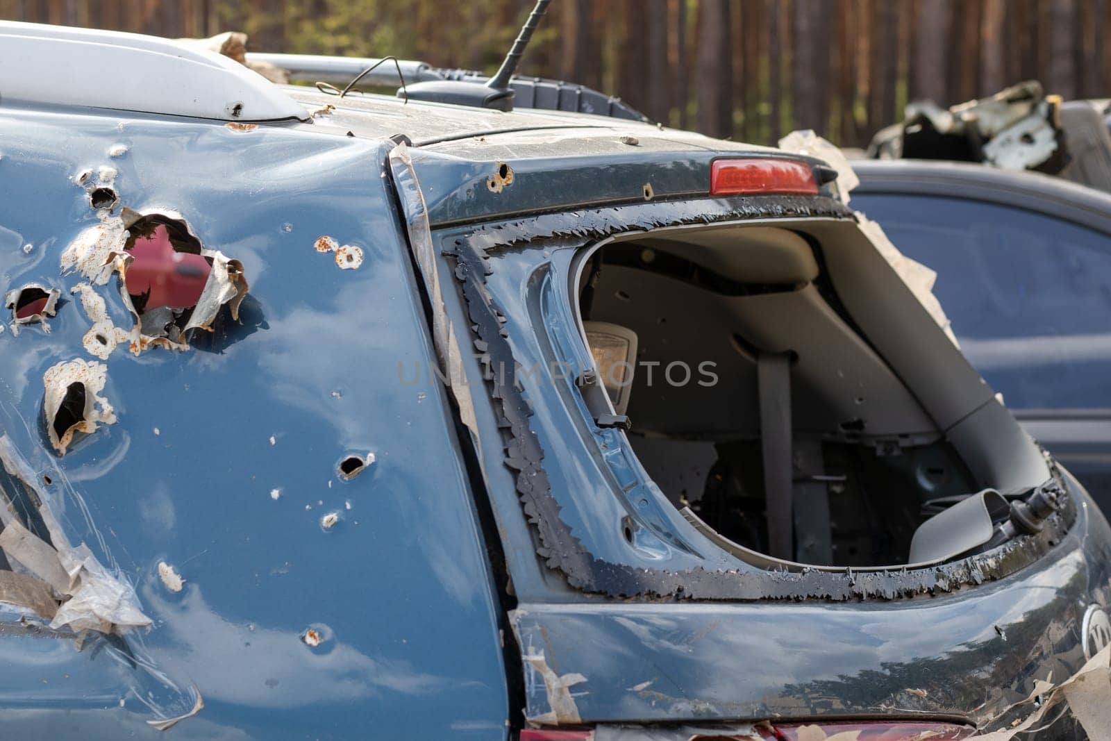 Car riddled with bullets. War of Russia against Ukraine. A car of civilians shot by the Russian military during the evacuation of women and children. Traces of bullets and fragments of shells