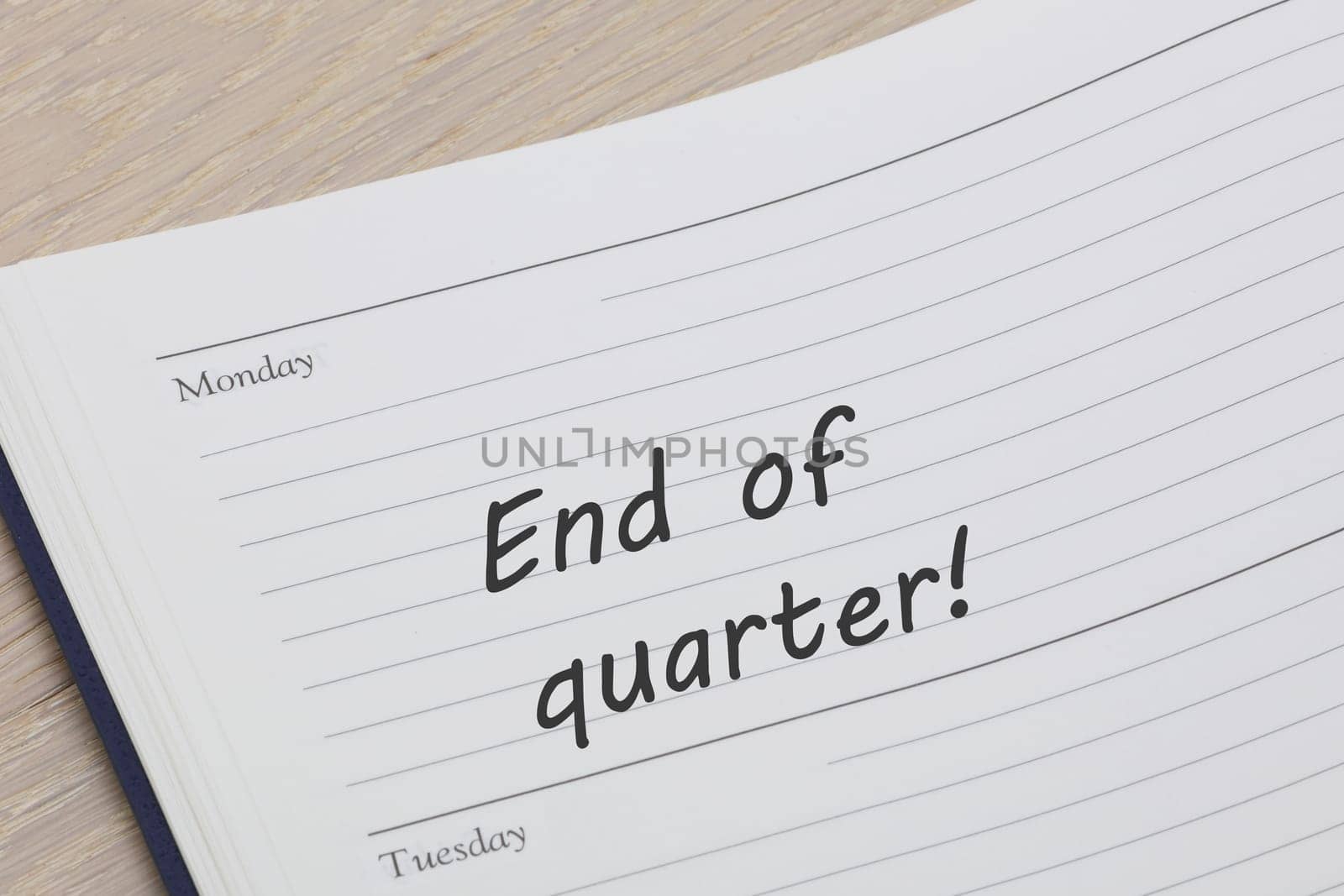 An end of quarter reminder note in a diary page