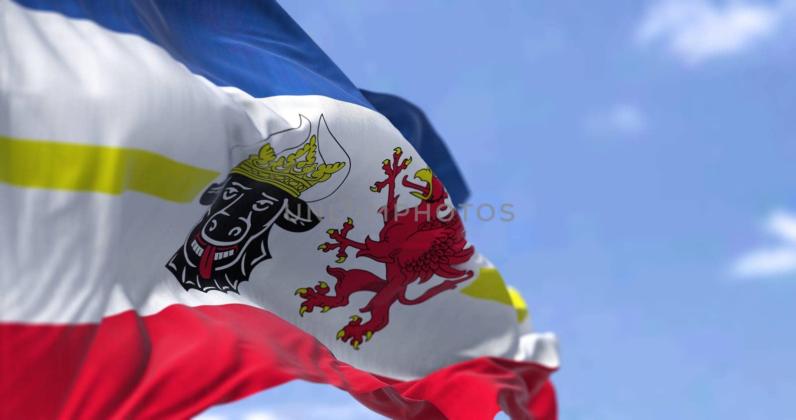 The flag of Mecklenburg–Western Pomerania waving in the wind on a clear day. Mecklenburg–Western Pomerania is a German state (Land) situated in in the north-east of Germany
