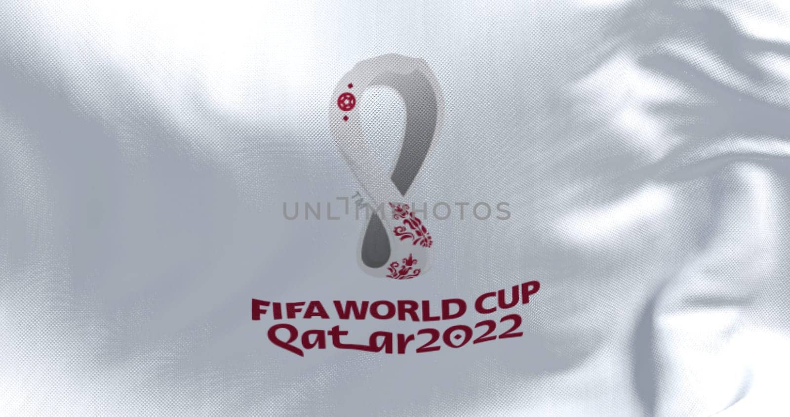 Doha, Qatar, October 2021: Flag with the 2022 Fifa World Cup logo flapping in the wind. The event is scheduled in Qatar from 21 November to 18 December 2022