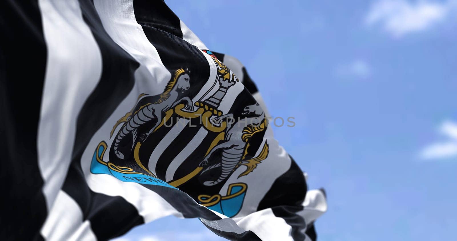 Newcastle, UK, May 2022: The flag of Newcastle United waving in the wind on a clear day. Newcastle United is an English professional football club based in Newcastle upon Tyne