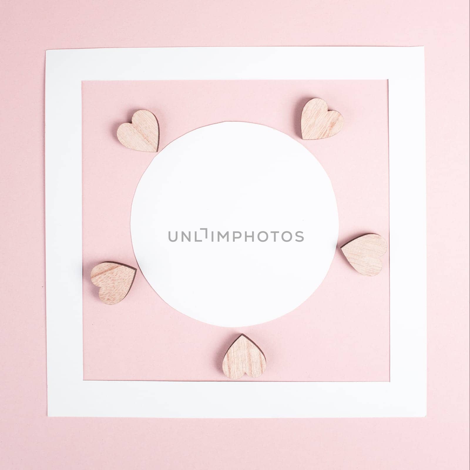Pastel colored greeting card, white circle with copy space for text and hearts, valentines day, mothers day background, romantic layout, love concept