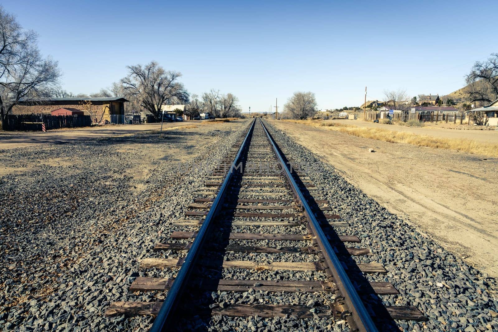 Railroad line through a small town of Los Cerillos in New Mexico