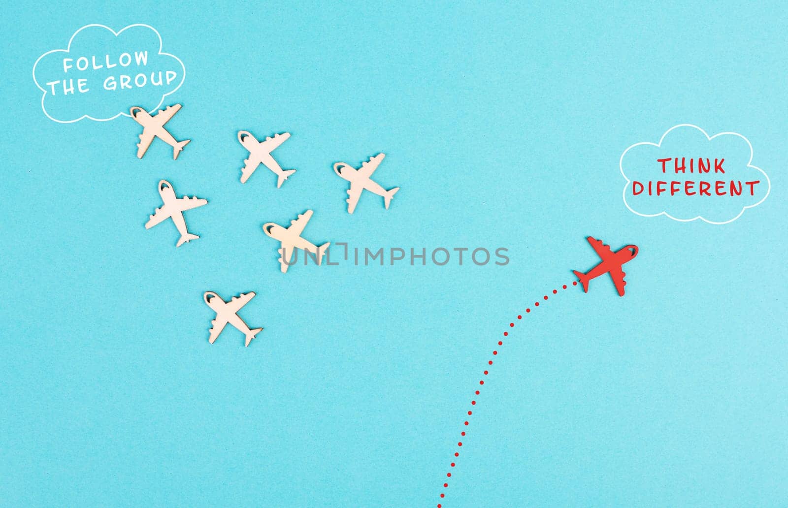 Airplanes following the group, red plane thinks different and takes the opposite direction, leadership, courage and winner concept