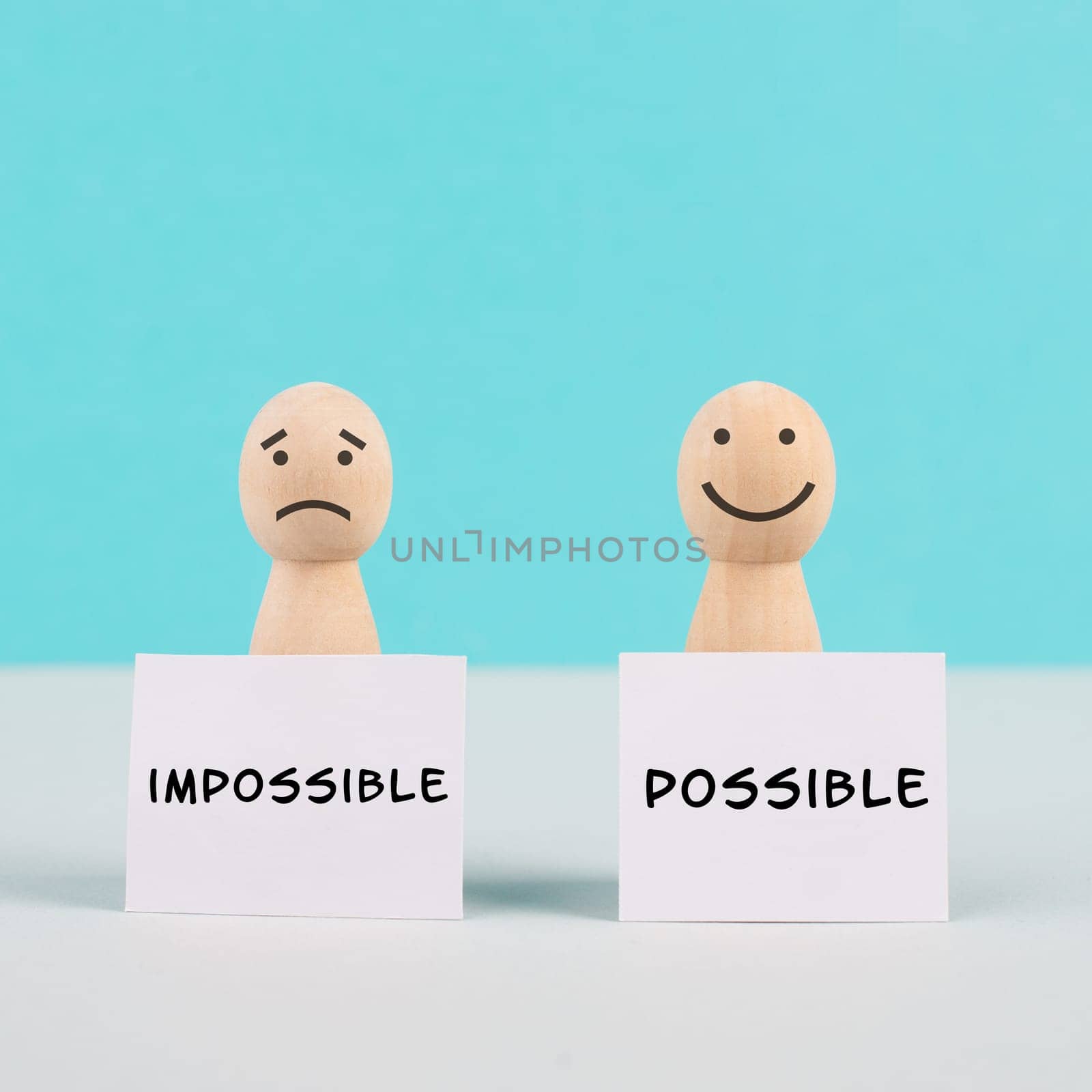 Two men holding signs, possible and impossible concept, mindset of an optimist and a pessimist, change the attitude for progress