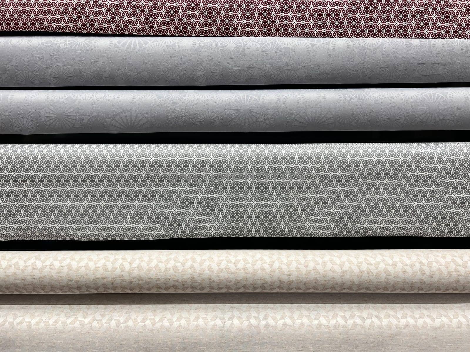 front view closeup of upholstery tapestry selection on rolls in shop